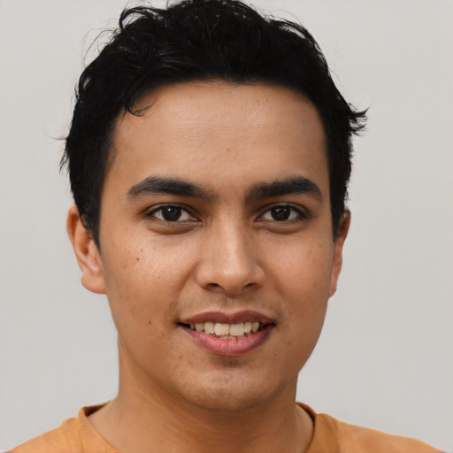 Joyful asian young-adult male with short  black hair and brown eyes