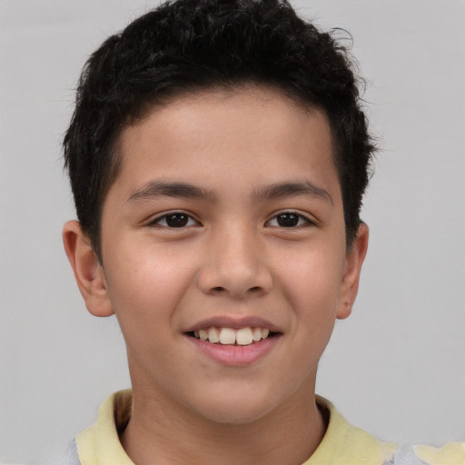 Joyful white child male with short  brown hair and brown eyes