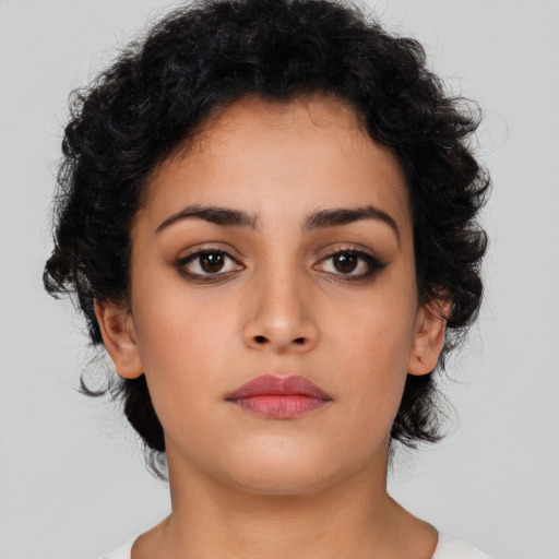 Neutral latino young-adult female with medium  brown hair and brown eyes