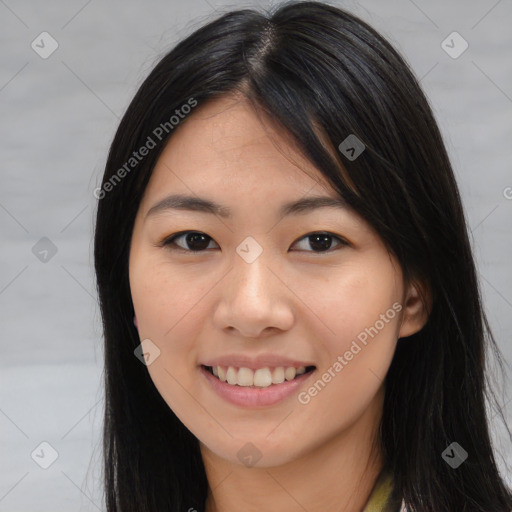 Joyful asian young-adult female with long  brown hair and brown eyes