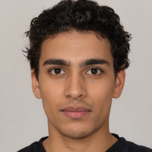 Neutral latino young-adult male with short  brown hair and brown eyes