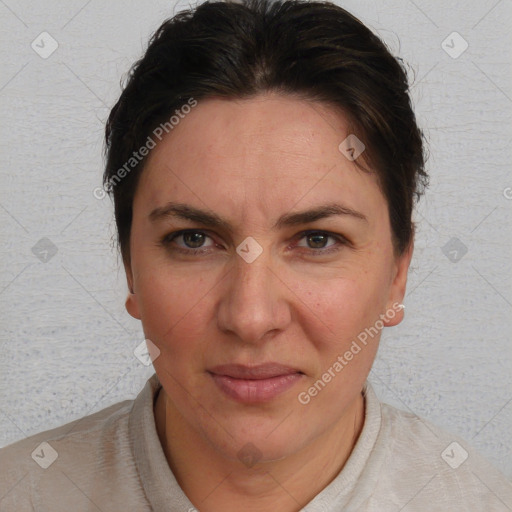 Joyful white adult female with short  brown hair and brown eyes