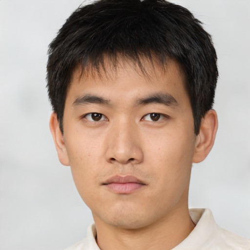 Neutral asian young-adult male with short  brown hair and brown eyes