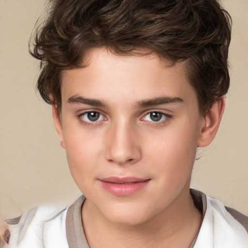 Joyful white child male with short  brown hair and brown eyes