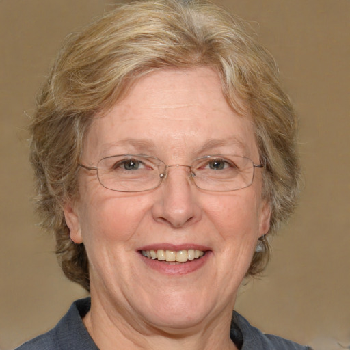 Joyful white middle-aged female with medium  brown hair and blue eyes