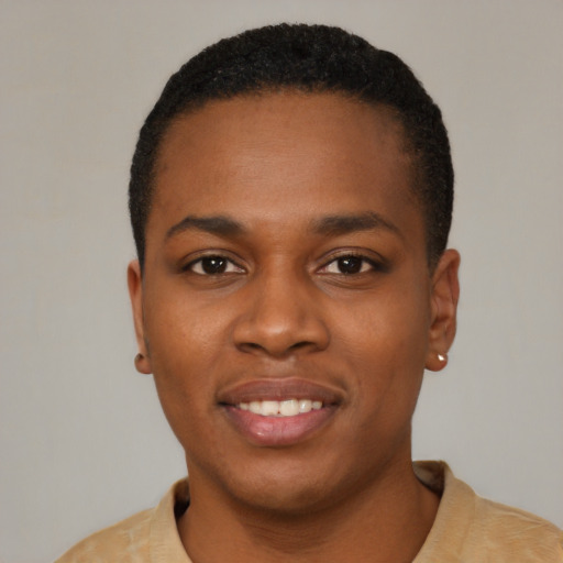 Joyful black young-adult male with short  black hair and brown eyes
