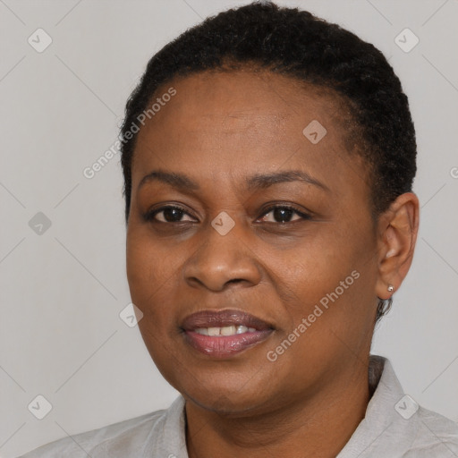 Joyful black adult female with short  brown hair and brown eyes