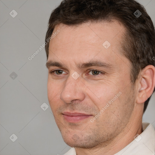 Joyful white adult male with short  brown hair and brown eyes