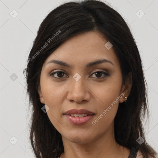 Joyful latino young-adult female with long  brown hair and brown eyes