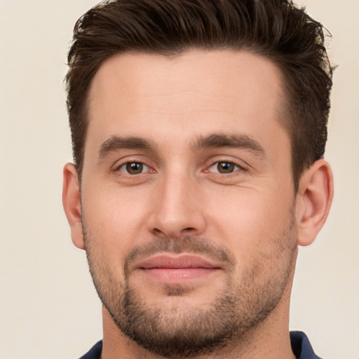 Joyful white young-adult male with short  brown hair and brown eyes