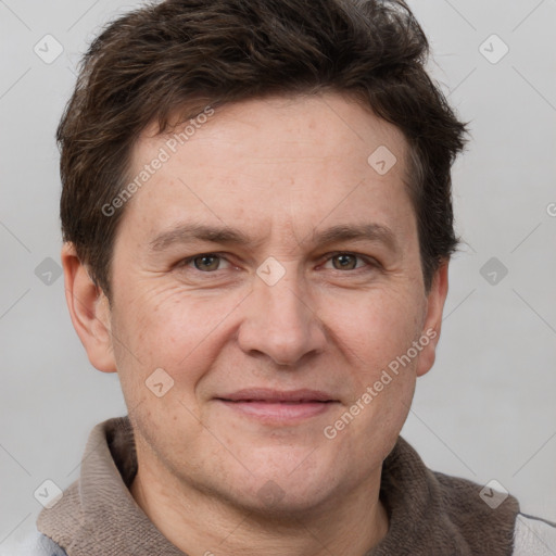 Joyful white adult male with short  brown hair and grey eyes