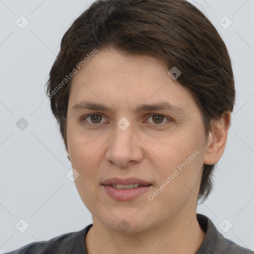 Joyful white adult female with short  brown hair and grey eyes