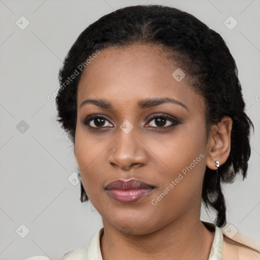 Joyful black young-adult female with medium  black hair and brown eyes