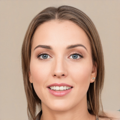 Joyful white young-adult female with medium  brown hair and grey eyes