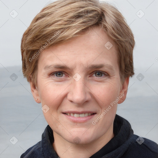 Joyful white adult female with short  brown hair and grey eyes