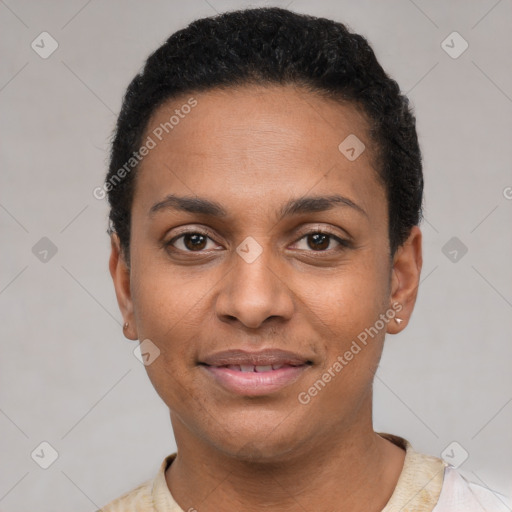 Joyful black young-adult female with short  black hair and brown eyes