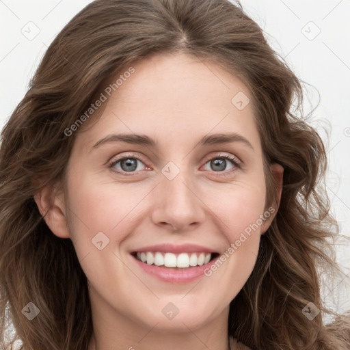 Joyful white young-adult female with long  brown hair and blue eyes