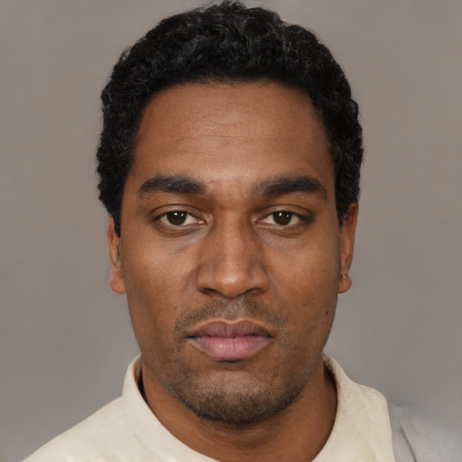 Neutral black young-adult male with short  black hair and brown eyes