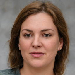 Joyful white young-adult female with medium  brown hair and blue eyes