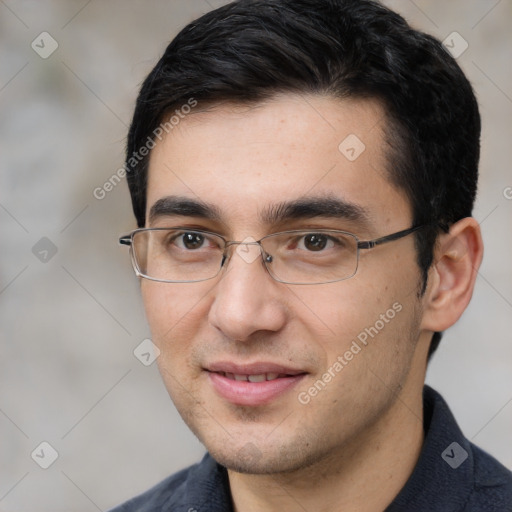 Joyful white young-adult male with short  black hair and brown eyes