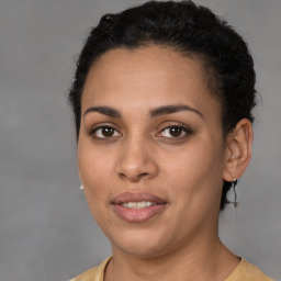 Joyful latino young-adult female with short  brown hair and brown eyes