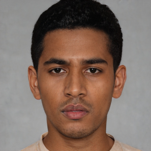 Neutral latino young-adult male with short  black hair and brown eyes