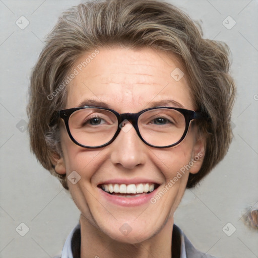 Joyful white adult female with medium  brown hair and blue eyes