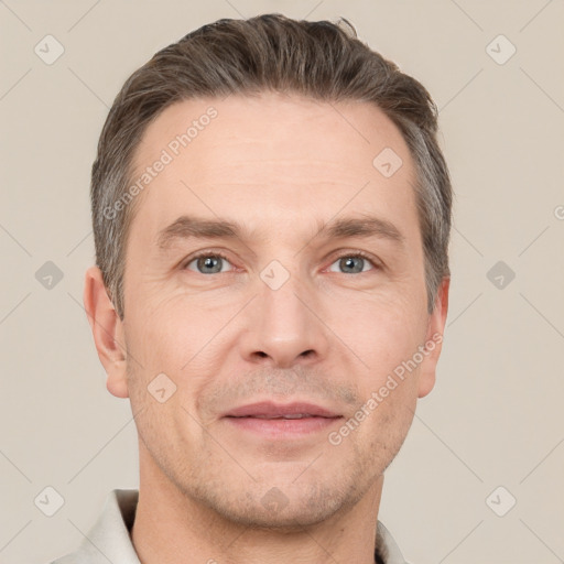 Joyful white adult male with short  brown hair and grey eyes