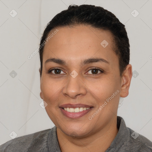 Joyful latino young-adult female with short  black hair and brown eyes