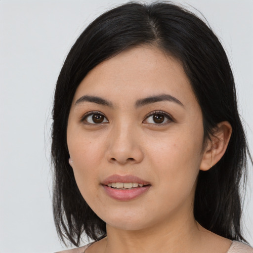 Joyful asian young-adult female with medium  black hair and brown eyes