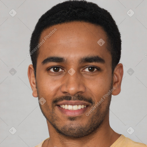 Joyful black young-adult male with short  black hair and brown eyes