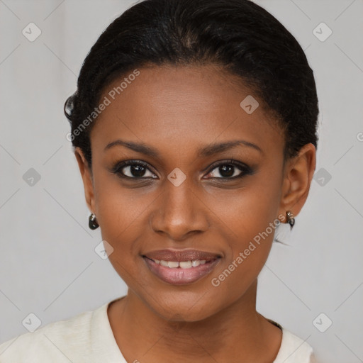 Joyful black young-adult female with short  brown hair and brown eyes