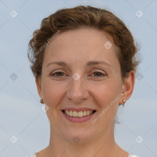 Joyful white adult female with short  brown hair and brown eyes