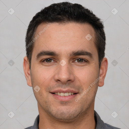 Joyful white young-adult male with short  brown hair and brown eyes