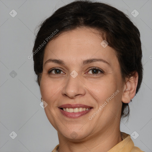 Joyful white adult female with medium  brown hair and brown eyes