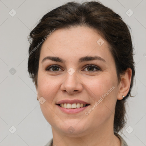 Joyful white young-adult female with medium  brown hair and brown eyes