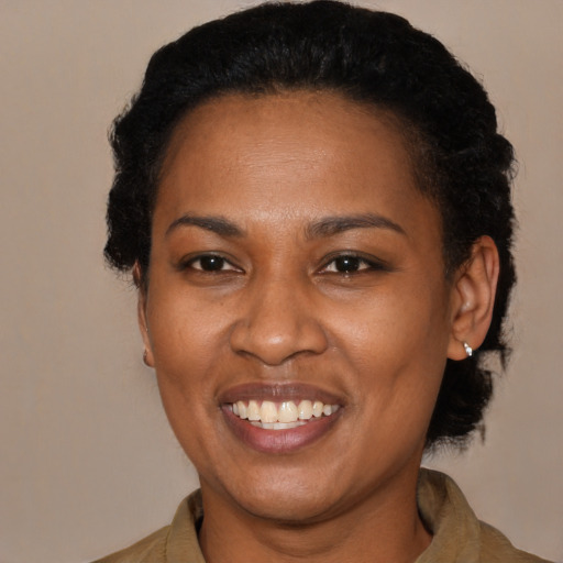 Joyful black young-adult female with medium  black hair and brown eyes