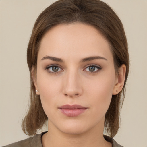 Neutral white young-adult female with medium  brown hair and brown eyes