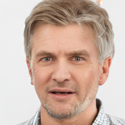 Joyful white adult male with short  brown hair and grey eyes