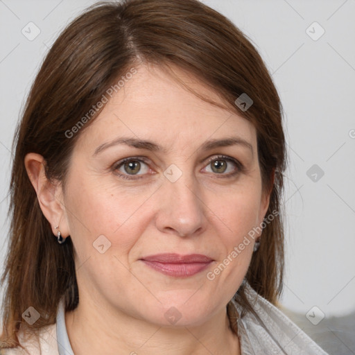 Joyful white adult female with medium  brown hair and brown eyes