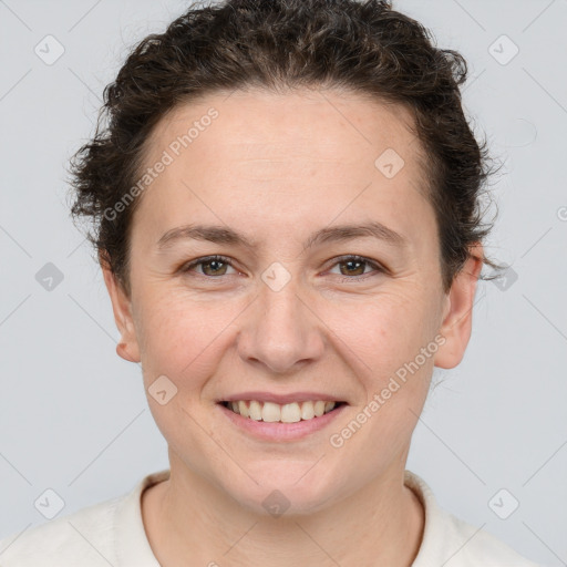 Joyful white adult female with short  brown hair and brown eyes