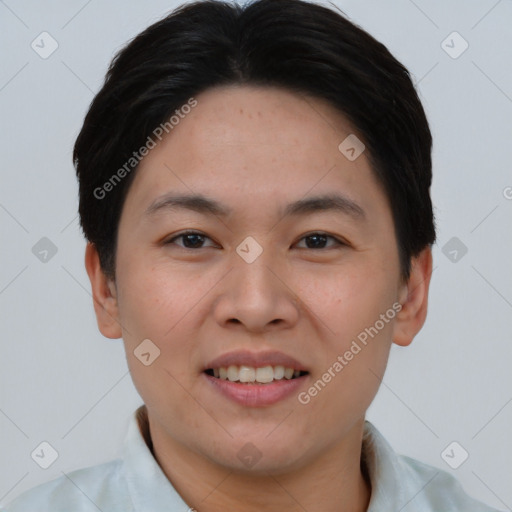 Joyful asian young-adult male with short  black hair and brown eyes