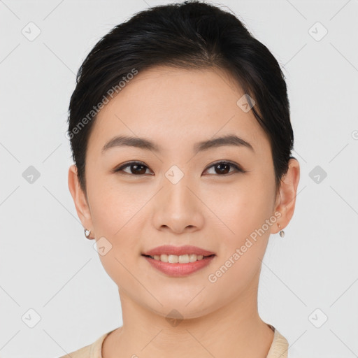 Joyful asian young-adult female with short  brown hair and brown eyes