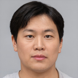 Neutral asian young-adult male with short  black hair and brown eyes