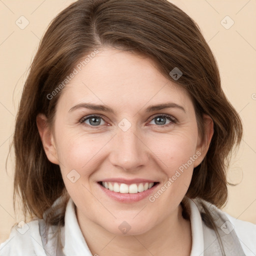 Joyful white young-adult female with medium  brown hair and grey eyes