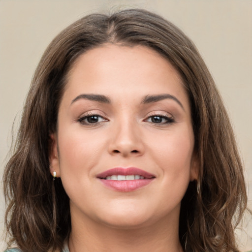 Joyful white young-adult female with long  brown hair and grey eyes