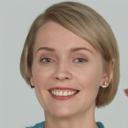 Joyful white young-adult female with medium  brown hair and blue eyes