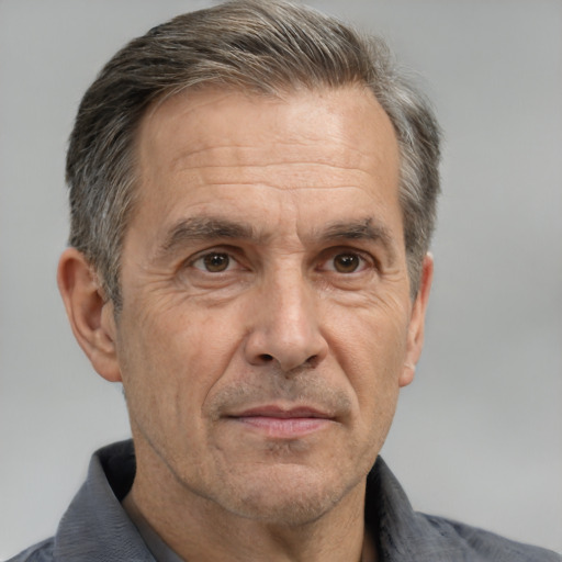 Neutral white middle-aged male with short  gray hair and brown eyes