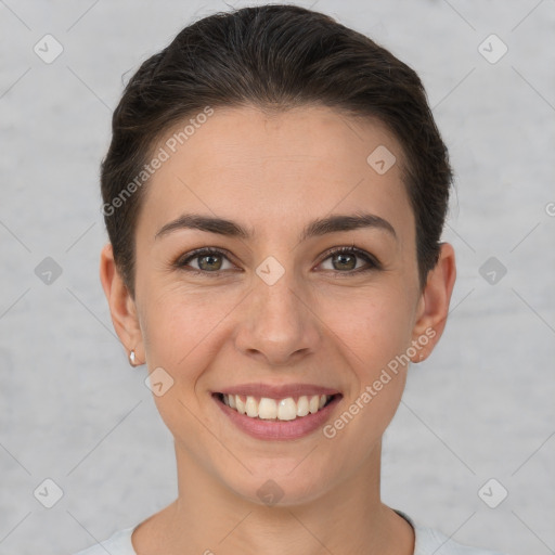 Joyful white young-adult female with short  brown hair and brown eyes