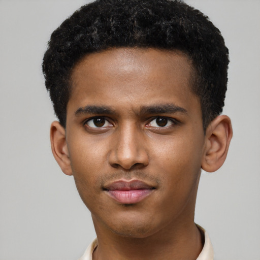 Joyful latino young-adult male with short  brown hair and brown eyes